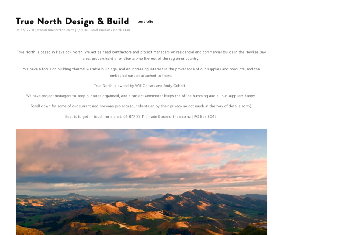 Current True North homepage — sparse centred text and a stock landscape photo